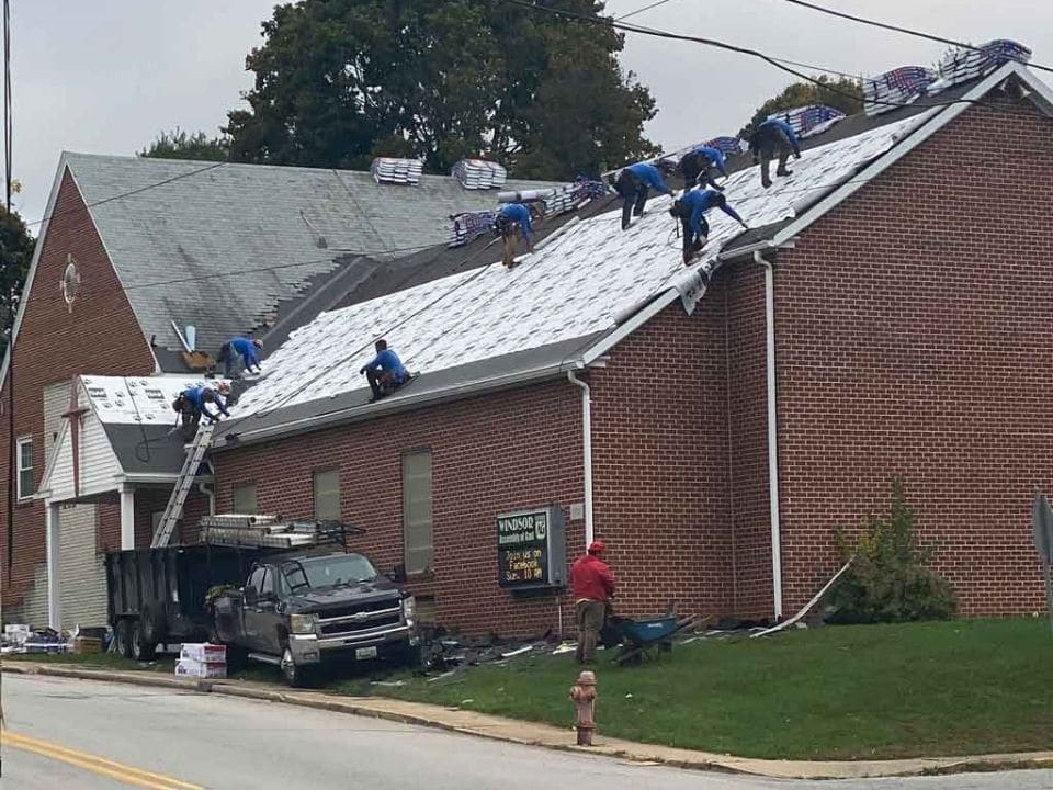 Grace Family Roofing Company team installing a roof in South Central Pennsylvania, focusing on quality craftsmanship.
